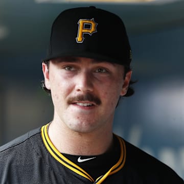 Aug 28, 2024; Pittsburgh, Pennsylvania, USA;  Pittsburgh Pirates starting pitcher Paul Skenes (30) looks on from the dugout against the Chicago Cubs during the second inning at PNC Park. Mandatory Credit: Charles LeClaire-Imagn Images