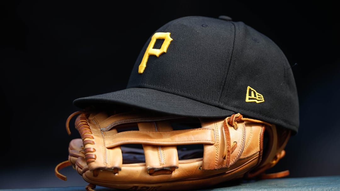 Jun 30, 2021; Denver, Colorado, USA; A general view of a Pittsburgh Pirates glove and hat in the eighth inning against the Colorado Rockies at Coors Field. Mandatory Credit: Isaiah J. Downing-USA TODAY Sports