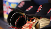 May 22, 2018; St. Petersburg, FL, USA; A general view of Boston Red Sox hats and gloves laying in the dugout at Tropicana Field. Mandatory Credit: Kim Klement-Imagn Images