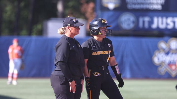 May 9, 2024; Auburn, AL, USA;  Missouri Tigers head coach Larissa Anderson talks with infielder Maddie Gallagher (1) during the game against the Florida Gators in the SEC Softball Championship game at Jane B. Moore Field. Mandatory Credit: John Reed-USA TODAY Sports