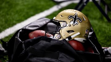Nov 5, 2023; New Orleans, Louisiana, USA;  Detailed view of the New Orleans Saints helmet and ball bag against the Chicago Bears during the first half at the Caesars Superdome. Mandatory Credit: Stephen Lew-Imagn Images