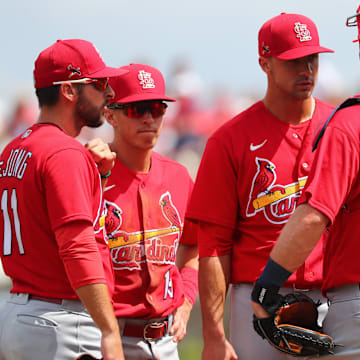 Mar 10, 2020; Fort Myers, Florida, USA; St. Louis Cardinals starting pitcher Jack Flaherty (22) talks with catcher Matt Wieters (32), shortstop Paul DeJong (11)  and second baseman Tommy Edman (19) on the mound during the second inning against the Boston Red Sox at JetBlue Park. Mandatory Credit: Kim Klement-Imagn Images