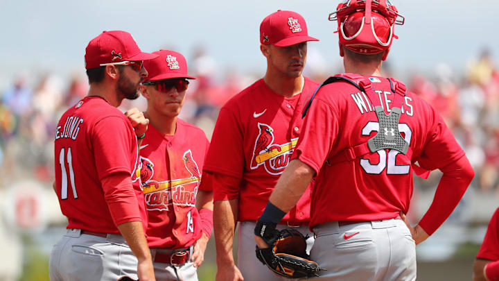 Mar 10, 2020; Fort Myers, Florida, USA; St. Louis Cardinals starting pitcher Jack Flaherty (22) talks with catcher Matt Wieters (32), shortstop Paul DeJong (11)  and second baseman Tommy Edman (19) on the mound during the second inning against the Boston Red Sox at JetBlue Park. Mandatory Credit: Kim Klement-Imagn Images