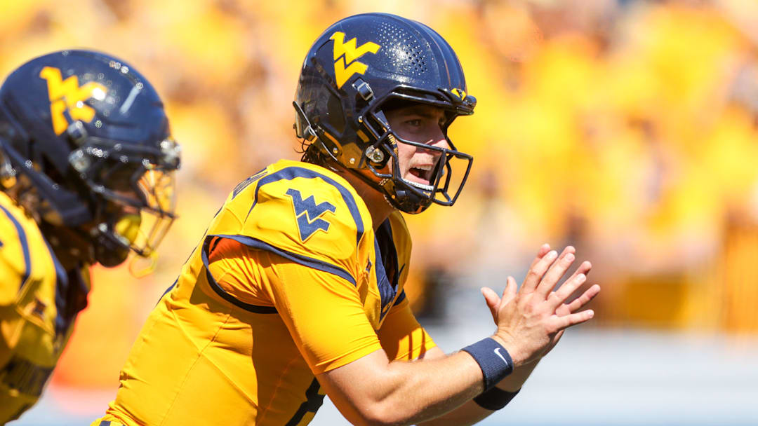 Aug 30, 2025; Morgantown, West Virginia, USA; West Virginia Mountaineers quarterback Nicco Marchiol (8) pauses before a snap during the first quarter against the Robert Morris Colonials at Milan Puskar Stadium. Mandatory Credit: Ben Queen-Imagn Images
