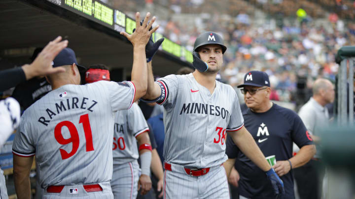 Jul 26, 2024; Detroit, Michigan, USA; Minnesota Twins outfielder Matt Wallner (38) high-fives teammates after scoring a run in the second inning against the Detroit Tigers at Comerica Park.