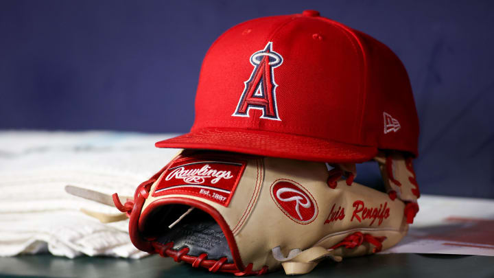 Aug 1, 2023; Atlanta, Georgia, USA; A detailed view of a Los Angeles Angels hat and glove on the bench against the Atlanta Braves in the eighth inning at Truist Park. Mandatory Credit: Brett Davis-USA TODAY Sports