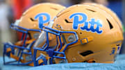 Sep 27, 2025; Pittsburgh, Pennsylvania, USA;  Pittsburgh Panthers helmets on the sidelines against the Louisville Cardinals during the second quarter at Acrisure Stadium. Mandatory Credit: Charles LeClaire-Imagn Images