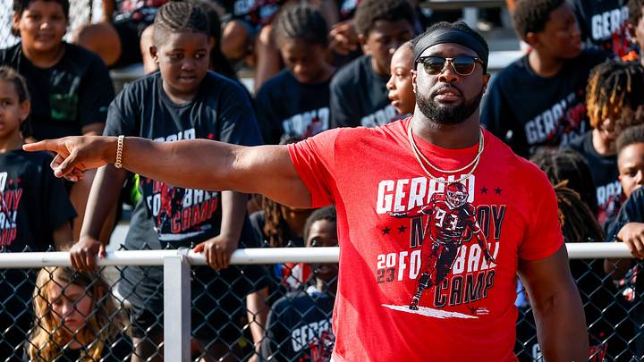 Gerald McCoy talks to children during a youth football camp hosted by McCoy and his Patricia Diane Foundation at Speegle Stadium in Oklahoma City on Thursday, June 22, 2023.