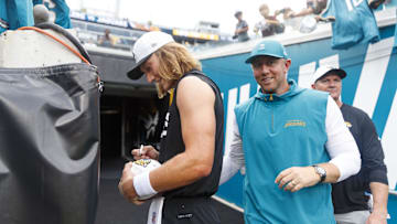 Aug 9, 2025; Jacksonville, Florida, USA;  Jacksonville Jaguars quarterback Trevor Lawrence (16) and head coach Liam Coen before the game against the Pittsburgh Steelers at EverBank Stadium. 