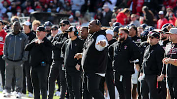 Nov 30, 2024; Lubbock, Texas, USA;  Texas Tech Red Raiders associate head coach Kenny Perry, head coach Joey McGuire and defensive line coach Zarnell Fitch on the sidelines in the first half during the game against the West Virginia Mountaineers at Jones AT&T Stadium and Cody Campbell Field. Mandatory Credit: Michael C. Johnson-Imagn Images