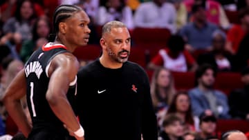 Feb 1, 2025; Houston, Texas, USA; Houston Rockets head coach Ime Udoka talks with Houston Rockets guard Amen Thompson (1) during a stoppage against the Brooklyn Nets during the second quarter at Toyota Center.