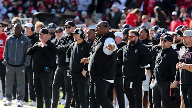 Texas Tech Red Raiders associate head coach Kenny Perry, head coach Joey McGuire and defensive line coach Zarnell Fitch