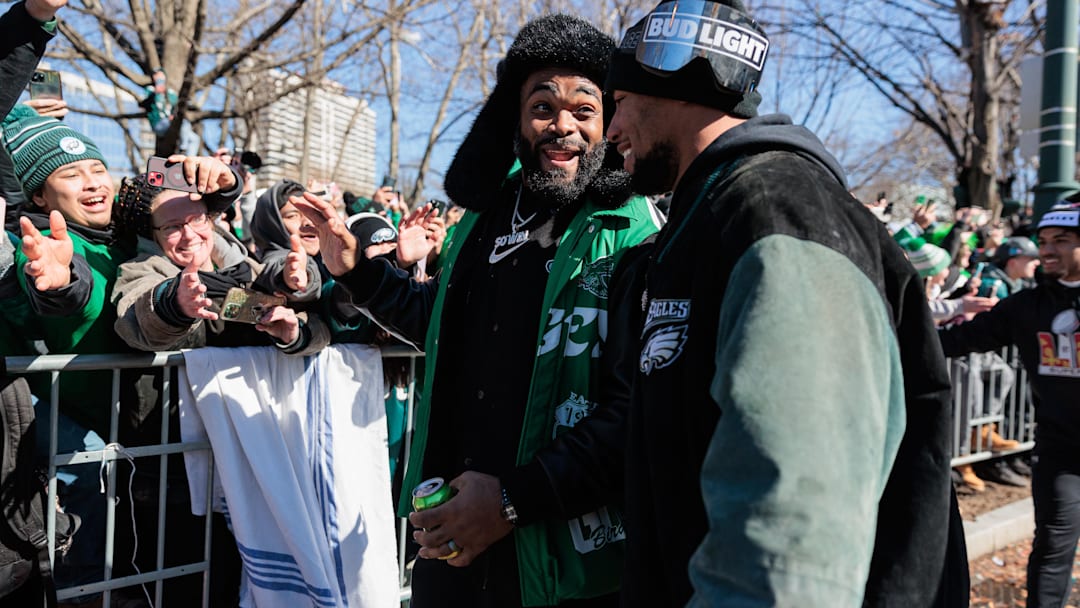 Feb 14, 2025; Philadelphia, PA, USA; Philadelphia Eagles defensive end Brandon Graham (55) speaks to running back Saquon Barkley (26) during the Super Bowl LIX championship parade and rally. Mandatory Credit: Caean Couto-Imagn Images Feb 14, 2025; Philadelphia, PA, USA; Philadelphia Eagles defensive end Brandon Graham (55) speaks to running back Saquon Barkley (26) during the Super Bowl LIX championship parade and rally. Mandatory Credit: Caean Couto-Imagn Images