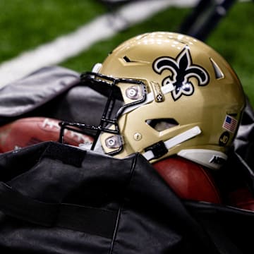 Nov 5, 2023; New Orleans, Louisiana, USA;  Detailed view of the New Orleans Saints helmet and ball bag against the Chicago Bears during the first half at the Caesars Superdome. Mandatory Credit: Stephen Lew-Imagn Images