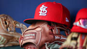 Sep 5, 2023; Atlanta, Georgia, USA; A detailed view of the hat and glove of St. Louis Cardinals second baseman Nolan Gorman (not pictured) before a game against the Atlanta Braves at Truist Park. Mandatory Credit: Brett Davis-Imagn Images