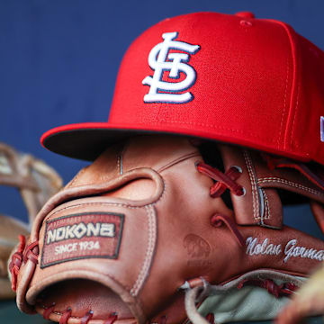 Sep 5, 2023; Atlanta, Georgia, USA; A detailed view of the hat and glove of St. Louis Cardinals second baseman Nolan Gorman (not pictured) before a game against the Atlanta Braves at Truist Park. Mandatory Credit: Brett Davis-Imagn Images
