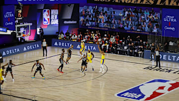 Aug 13, 2020; Lake Buena Vista, Florida, USA;  Quinn Cook #28 of the Los Angeles Lakers shoots a three point basket against the Sacramento Kings during the first quarter at The Field House at ESPN Wide World Of Sports Complex on August 13, 2020 in Lake Buena Vista, Florida. Mandatory Credit: Kevin C. Cox/Pool Photo-Imagn Images