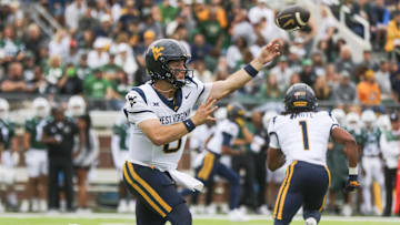 Sep 6, 2025; Athens, Ohio, USA; West Virginia Mountaineers quarterback Nicco Marchiol (8) throws a pass during the first quarter against the Ohio Bobcats at Peden Stadium. Mandatory Credit: Ben Queen-Imagn Images