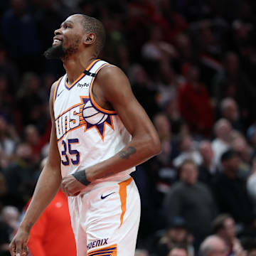 Phoenix Suns forward Durant laughs as he watches a replay during a game against the Portland Trail Blazers at Moda Center. 