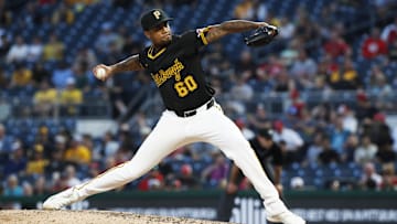 Jun 18, 2024; Pittsburgh, Pennsylvania, USA;  Pittsburgh Pirates relief pitcher Dennis Santana (60) pitches against the Cincinnati Reds during the ninth inning at PNC Park. The Reds won 2-1. Mandatory Credit: Charles LeClaire-Imagn Images