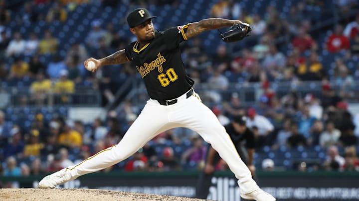 Jun 18, 2024; Pittsburgh, Pennsylvania, USA;  Pittsburgh Pirates relief pitcher Dennis Santana (60) pitches against the Cincinnati Reds during the ninth inning at PNC Park. The Reds won 2-1. Mandatory Credit: Charles LeClaire-Imagn Images