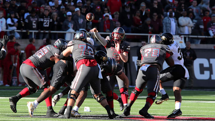 Nov 9, 2024; Lubbock, Texas, USA; Texas Tech Red Raiders quarterback Behren Morton (2) passes against the Colorado Buffalos in the first half at Jones AT&T Stadium and Cody Campbell Field. Mandatory Credit: Michael C. Johnson-Imagn Images