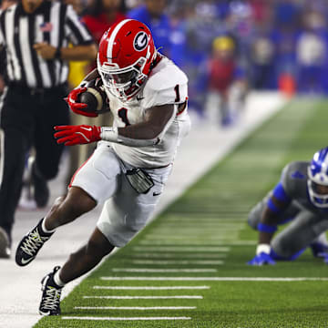 Sep 14, 2024; Lexington, Kentucky, USA; Georgia Bulldogs running back Trevor Etienne (1) runs out of bounds during the second half against Kentucky at Kroger Field. Georgia won 13-12. Mandatory Credit: Carter Skaggs-Imagn Images