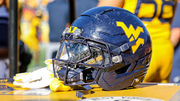 Aug 30, 2025; Morgantown, West Virginia, USA; A West Virginia Mountaineers football helmet is seen along the sidelines during the fourth quarter against the Robert Morris Colonials at Milan Puskar Stadium. Mandatory Credit: Ben Queen-Imagn Images