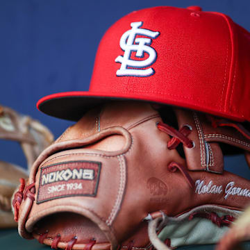 Sep 5, 2023; Atlanta, Georgia, USA; A detailed view of the hat and glove of St. Louis Cardinals second baseman Nolan Gorman (not pictured) before a game against the Atlanta Braves at Truist Park. Mandatory Credit: Brett Davis-Imagn Images