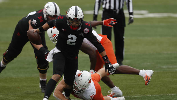 Nebraska Cornhuskers quarterback Adrian Martinez (2) runs against Illinois Fighting Illini linebacker Jake Hansen (35).