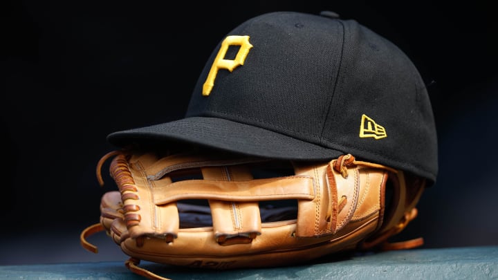 Jun 30, 2021; Denver, Colorado, USA; A general view of a Pittsburgh Pirates glove and hat in the eighth inning against the Colorado Rockies at Coors Field. Mandatory Credit: Isaiah J. Downing-USA TODAY Sports