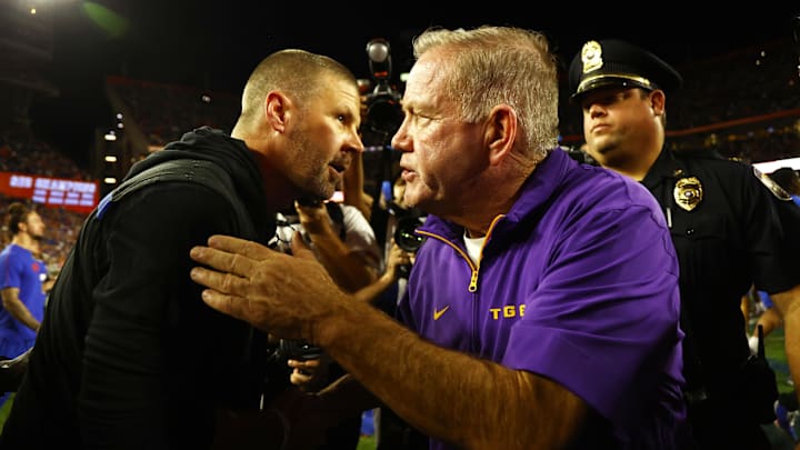 Nov 16, 2024; Gainesville, Florida, USA; LSU Tigers head coach Brian Kelly and Florida Gators head coach Billy Napier greet after the game at Ben Hill Griffin Stadium. Mandatory Credit: Kim Klement Neitzel-Imagn Images