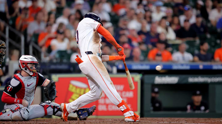 Jun 2, 2024; Houston, Texas, USA; Houston Astros designated hitter Kyle Tucker (30) hits a single against the Minnesota Twins during the third inning at Minute Maid Park.