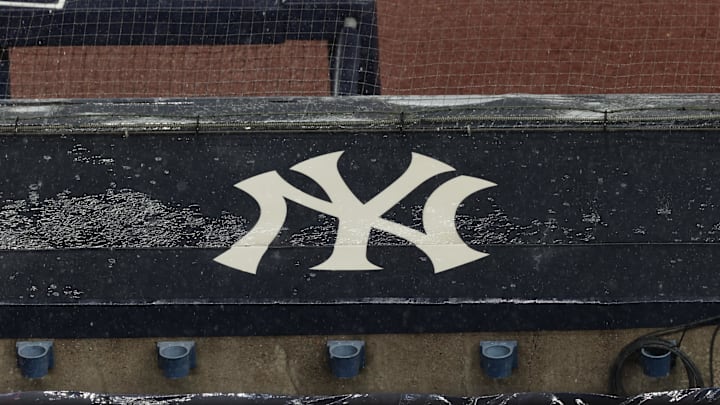 Aug 17, 2020; Bronx, New York, USA; A general view of rain falling on the New York Yankees logo on the first base dugout roof during a rain delay in the game between the New York Yankees and the Boston Red Sox. Mandatory Credit: Vincent Carchietta-Imagn Images Aug 17, 2020; Bronx, New York, USA; A general view of rain falling on the New York Yankees logo on the first base dugout roof during a rain delay in the game between the New York Yankees and the Boston Red Sox. Mandatory Credit: Vincent Carchietta-Imagn Images