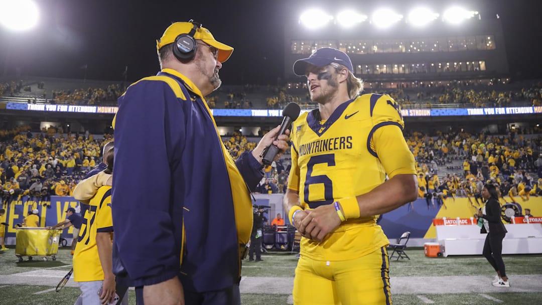 Sep 7, 2024; Morgantown, West Virginia, USA; West Virginia Mountaineers quarterback Garrett Greene (6) is interviewed after defeating the Albany Great Danes at Mountaineer Field at Milan Puskar Stadium. Mandatory Credit: Ben Queen-Imagn Images