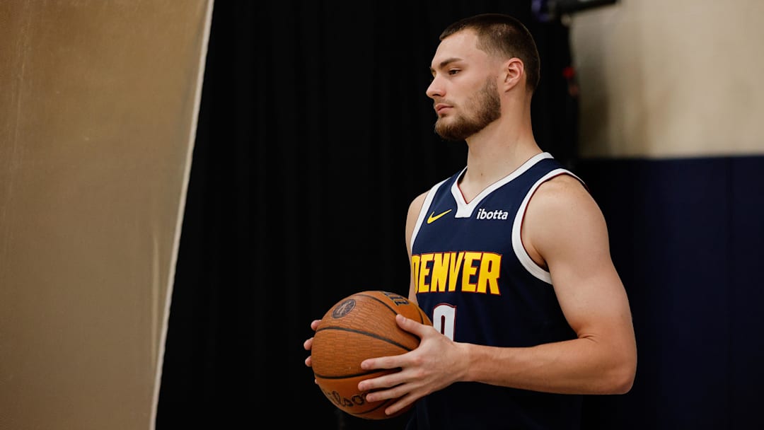 Sep 29, 2025; Denver, CO, USA; Denver Nuggets player Christian Braun (0) poses for a picture during media day at Ball Arena. Mandatory Credit: Isaiah J. Downing-Imagn Images