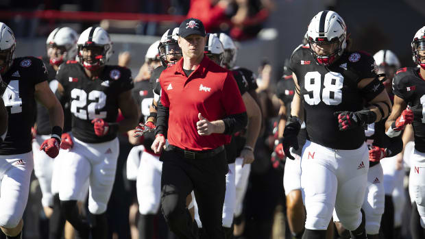 Nebraska Cornhuskers head coach Scott Frost leads his team onto the field against the Indiana Hoosiers.