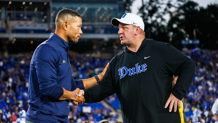 Sep 30, 2023; Durham, North Carolina, USA; Duke Blue Devils head coach Mike Elko and Notre Dame Fighting Irish head coach Marcus Freeman meet just before the game at Wallace Wade Stadium. Mandatory Credit: Jaylynn Nash-USA TODAY Sports