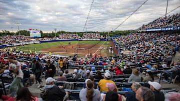 May 29, 2025; Oklahoma City, OK, USA;  Fans enjoy the game between the Ole Miss Rebels and the Texas Tech Red Raiders during the NCAA Softball Women's College World Series at Devon Park. Mandatory Credit: Brett Rojo-Imagn Images
