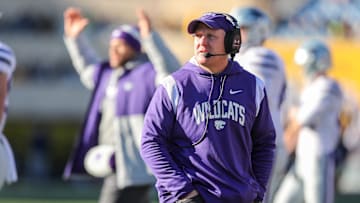 Nov 19, 2022; Morgantown, West Virginia, USA; Kansas State Wildcats head coach Chris Klieman watches a replay during the first quarter against the West Virginia Mountaineers at Mountaineer Field at Milan Puskar Stadium. Mandatory Credit: Ben Queen-USA TODAY Sports