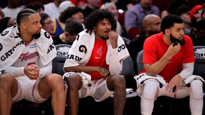 Mar 23, 2024; Houston, Texas, USA; (from L-to-R) Houston Rockets forward Dillon Brooks (9), Houston Rockets guard Jalen Green (4) and Houston Rockets guard Fred VanVleet (5) sit on the bench against the Utah Jazz during the second quarter at Toyota Center. Mandatory Credit: Erik Williams-USA TODAY Sports