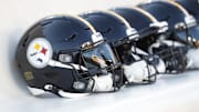 Oct 6, 2024; Pittsburgh, Pennsylvania, USA; Pittsburgh Steelers helmets on the bench before a game against the Dallas Cowboys at Acrisure Stadium. Mandatory Credit: Charles LeClaire-Imagn Images