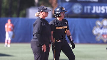 May 9, 2024; Auburn, AL, USA;  Missouri Tigers head coach Larissa Anderson talks with infielder Maddie Gallagher (1) during the game against the Florida Gators in the SEC Softball Championship game at Jane B. Moore Field. Mandatory Credit: John Reed-Imagn Images