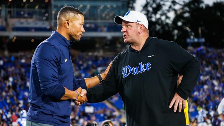 Sep 30, 2023; Durham, North Carolina, USA; Duke Blue Devils head coach Mike Elko and Notre Dame Fighting Irish head coach Marcus Freeman meet just before the game at Wallace Wade Stadium.