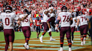 Sep 27, 2025; Raleigh, N.C.; Virginia Tech running back Marcellous Hawkins (27) makes a touchdown and celebrates with offensive lineman Johnny Garrett (79).