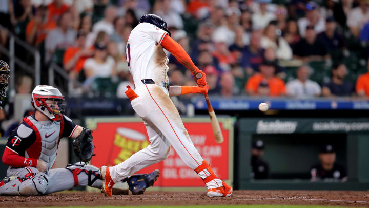 Jun 2, 2024; Houston, Texas, USA; Houston Astros designated hitter Kyle Tucker (30) hits a single against the Minnesota Twins during the third inning at Minute Maid Park.