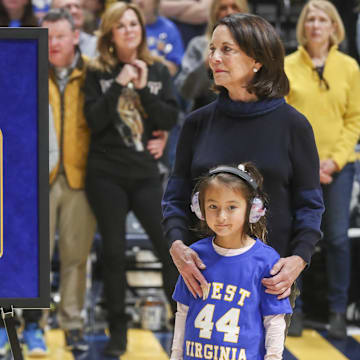Jan 18, 2025; Morgantown, West Virginia, USA; Karen West, wife of Naismith Memorial Basketball Hall of Famer Jerry West, watches on during a ceremony honoring her late husband at halftime against the Iowa State Cyclones at WVU Coliseum. Mandatory Credit: Ben Queen-Imagn Images