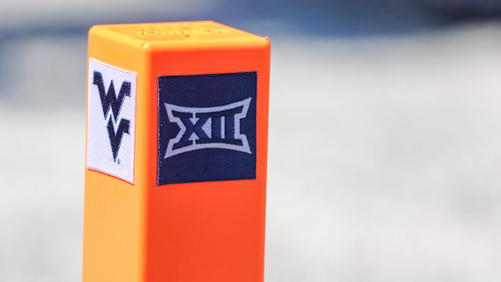 Aug 30, 2025; Morgantown, West Virginia, USA; A pylon displays the West Virginia University logo and the Big 12 Conference logo during the game against the Robert Morris Colonials at Milan Puskar Stadium. Mandatory Credit: Ben Queen-Imagn Images