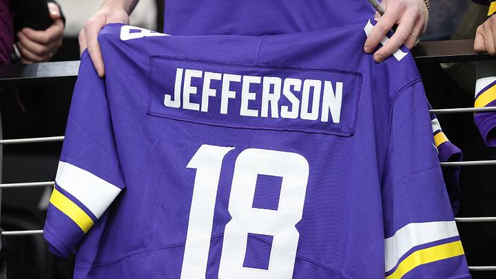Fan holding a Justin Jefferson jersey