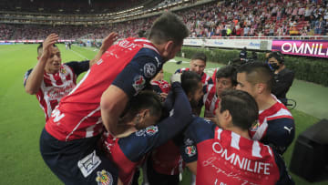 Chivas del Guadalajara players celebrate a goal against Puebla.